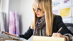 Female tailor working at desk