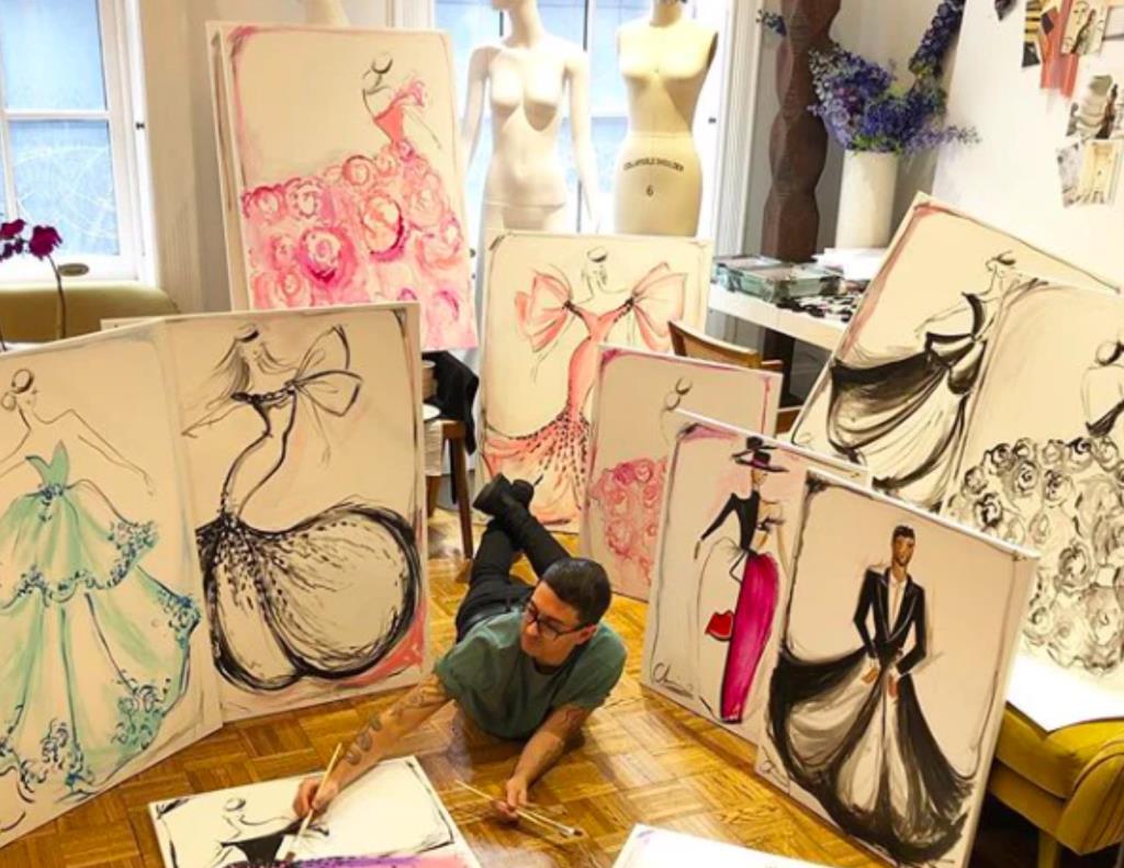 Christian Siriano showing his limited edition fashion illustrations