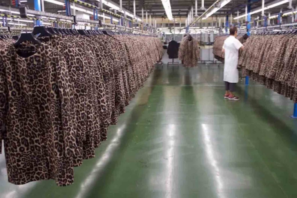 Rows of jackets hang in a Zara manufacturing facility (Photo credit: Business Insider/Mary Hanbury)