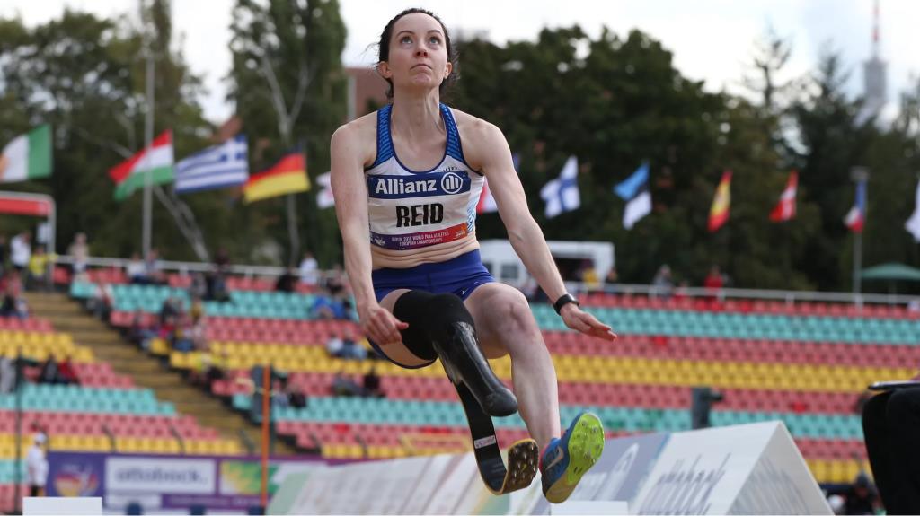 Amputee jumping a hurdle