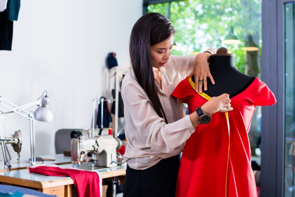 student measuring neckline 